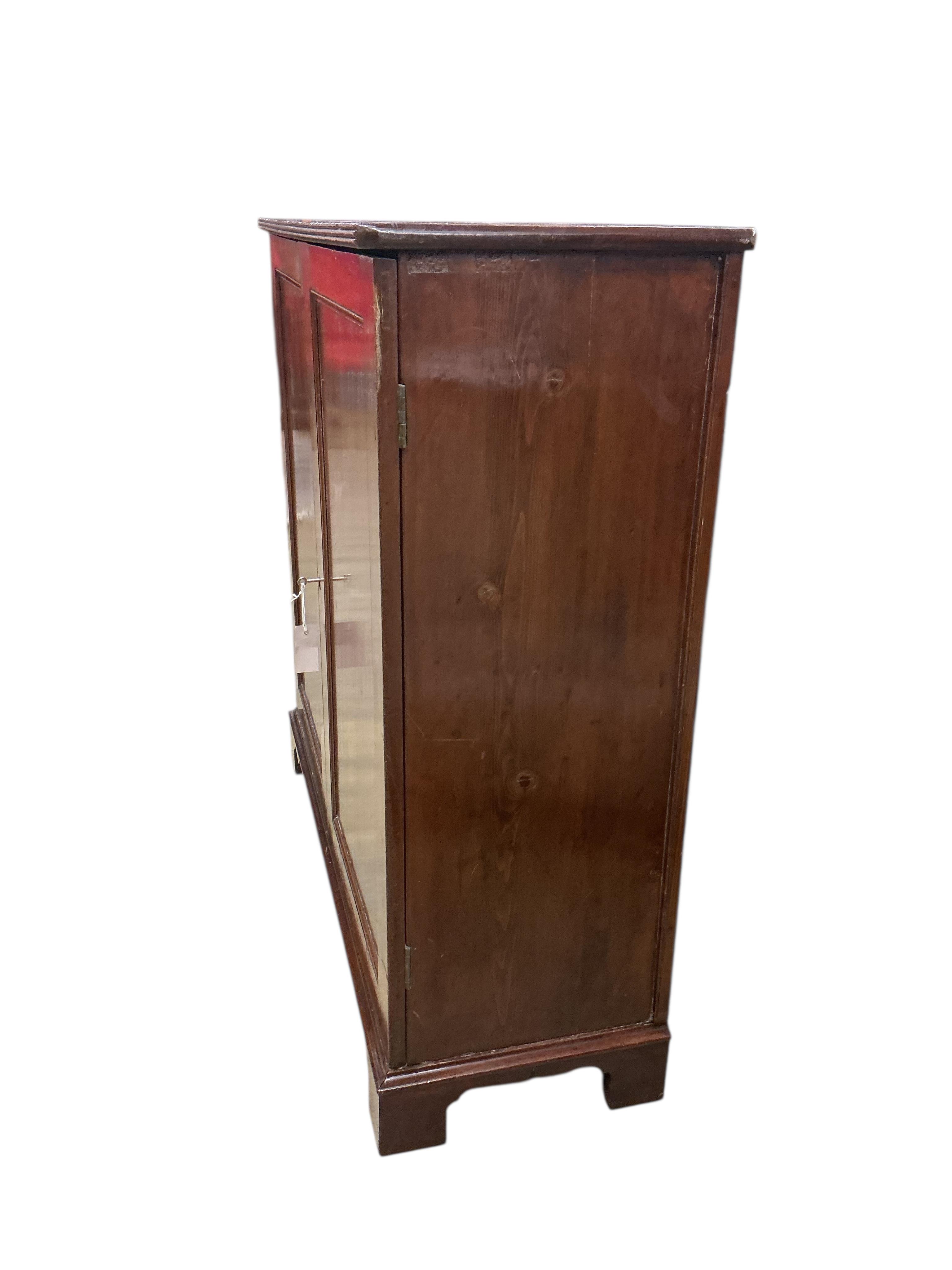 An early 19th century mahogany two door side cabinet, width 103cm, depth 37cm, height 104cm